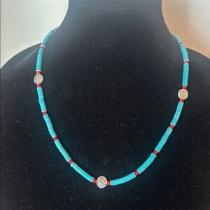 Turquoise Colored Bead Necklace With Aztec Inspired Design Discs